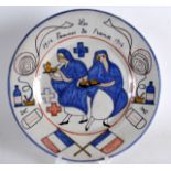 A RARE FRENCH QUIMPER FAIENCE POTTERY WW1 PLATE depicting two French nurses C1914-1916, the