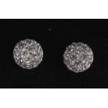 A PAIR OF 18CT DIAMOND SET SOLITAIRE STYLE EAR STUDS.