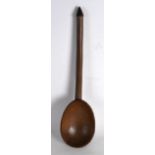 AN UNUSUAL EARLY 20TH CENTURY AFRICAN CARVED HARDWOOD LADLE with large bowl and tapering terminal.