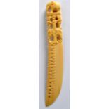 AN EARLY 20TH CENTURY AFRICAN CARVED IVORY PAPERKNIFE C1910 with elephant terminal. 10Ins long.