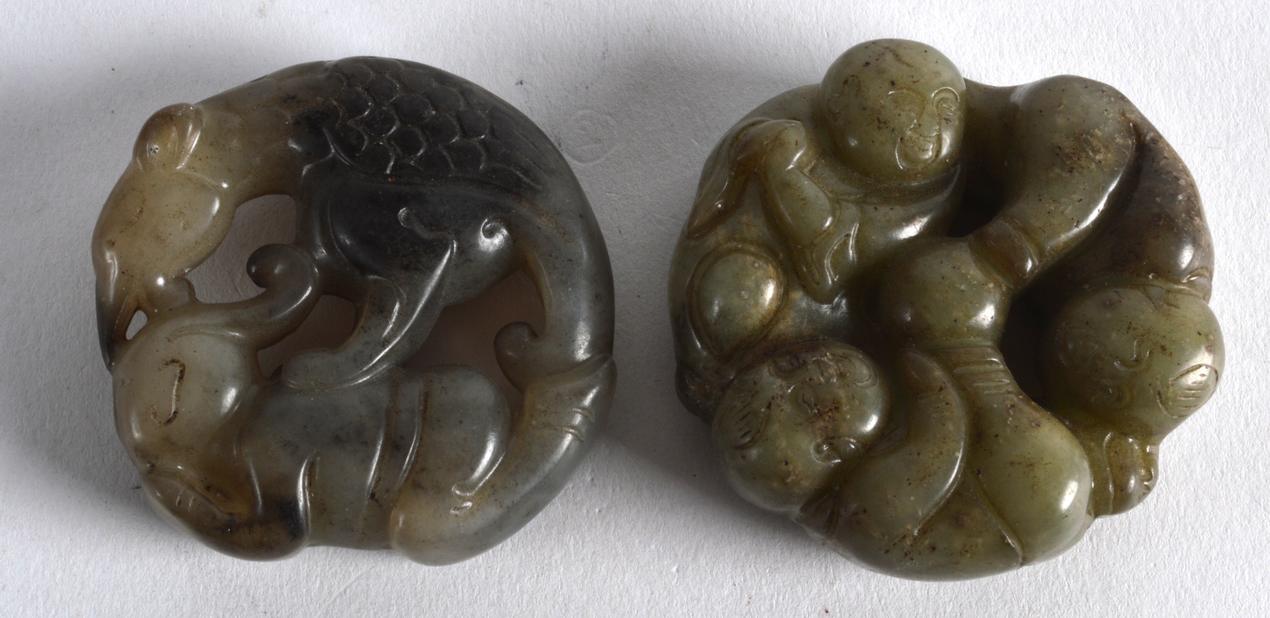 A CHINESE CARVED JADE FIGURE OF THE HE HE ERXIAN TWINS together with another group. 2Ins