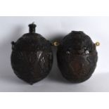 A FINE PAIR OF MID 19TH CENTURY CARVED COCONUTS decorated with hunting scenes.