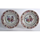 A PAIR OF 18TH CENTURY CHINESE FAMILLE ROSE PLATES Yongzheng, decorated with stylised flowers and