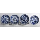 A SET OF SEVEN 19TH CENTURY CHINESE BLUE AND WHITE SAUCERS bearing Qianlong marks to base, painte