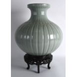A LARGE CHINESE GREEN CELADON BULBOUS VASE Qing/Republic, of thatch with rope twist mounts. 1Ft 2.
