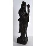 A 19TH CENTURY CHINESE CARVED HARDWOOD SILVER INLAID FIGURE modelled holding aloft a staff. 1Ft 4ins