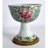 A LATE 18TH CENTURY CHINESE FAMILLE ROSE PORCELAIN STEM CUP Qianlong, painted with foliage and