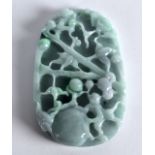 A CHINESE CARVED JADEITE PLAQUE decorated with flowers and vines. 2Ins x 3.25ins.