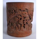 A FINE 19TH CENTURY CHINESE CARVED BAMBOO BRUSH POT formed with figures seated under pine trees. 7.