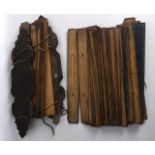 AN INTERESTING GROUP OF 19TH CENTURY SOUTH EAST ASIAN PRAYER PALM LEAVES decorated with inscriptions
