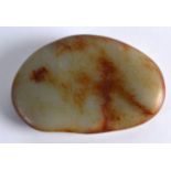 A CHINESE CARVED CELADON JADE PEBBLE probably late Qing, of plain form with russet inclusions. 4.