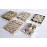 A SET OF FIVE VICTORIAN CARVED MOTHER OF PEARL CARD CASES of various forms and designs. Largest 4.