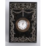 A RUSSIAN SILVER AND HARDSTONE STRUT CLOCK in the Faberge style, overlaid with vines. 4.5ins x 6.