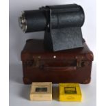 A 1930S MAGIC LANTERN together with 2 x boxes of slides, within a leather case. (qty)