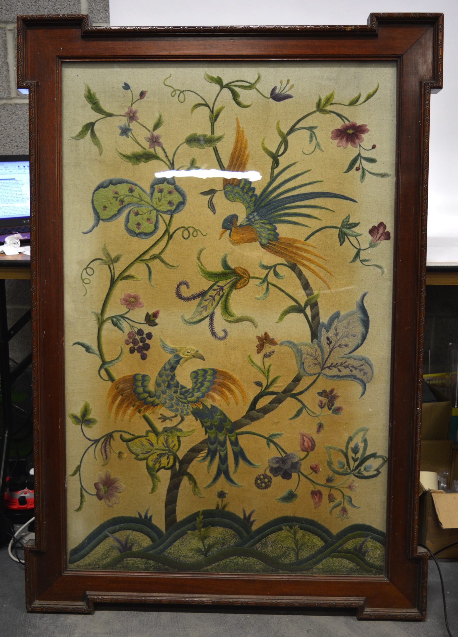 A VERY LARGE VICTORIAN MAHOGANY FRAMED EMBROIDERY depicting a parrot & other bird within an