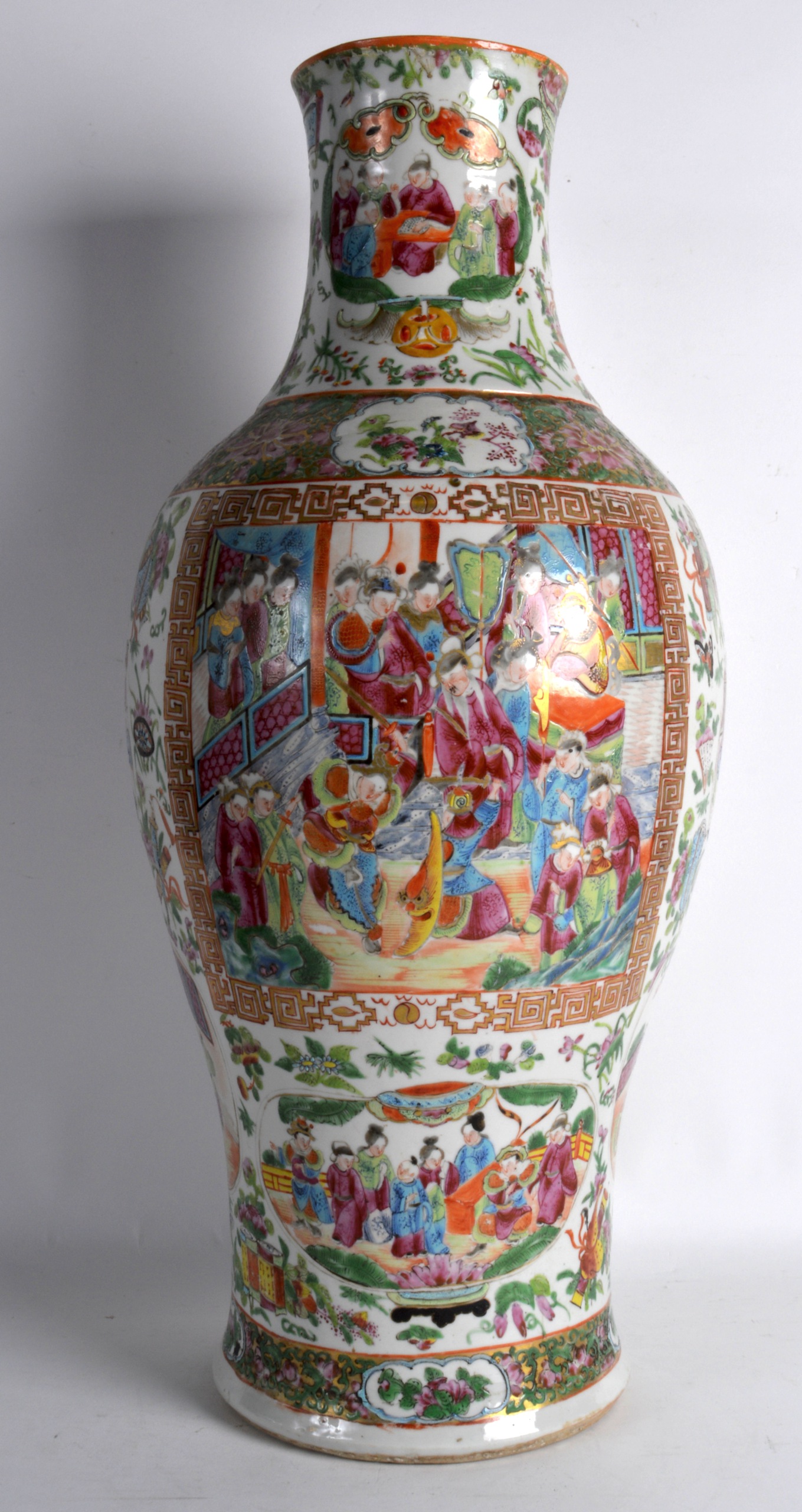 A LARGE 19TH CENTURY CHINESE CANTON FAMILLE ROSE BALUSTER VASE painted with figures within