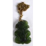 AN UNUSUAL MAORI CARVED JADE TIKI NECKLACE. Jade 1ins x 1.5ins.