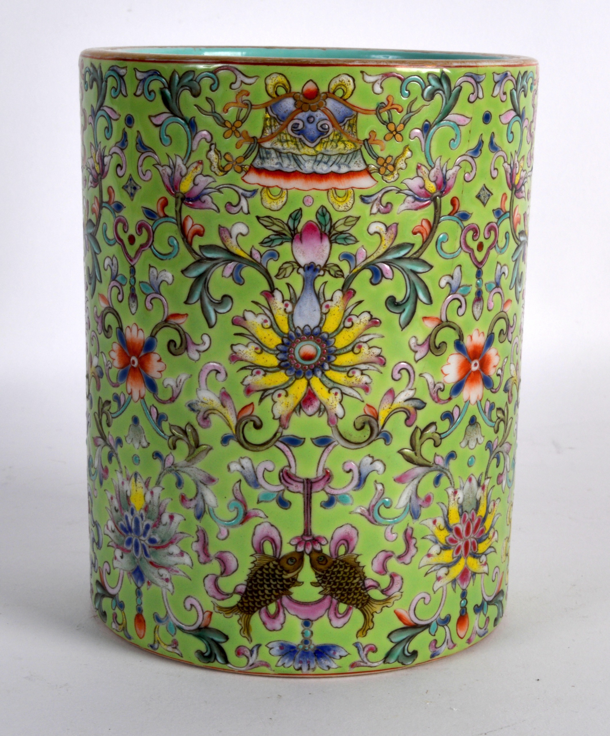 A GOOD CHINESE LIME GREEN GROUND PORCELAIN BRUSH POT bearing Qianlong marks to base, painted with