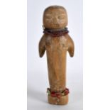 AN UNUSUAL EARLY 20TH CENTURY CARVED WOOD TRIBAL DOLL with coral fittings. 5.5ins high.