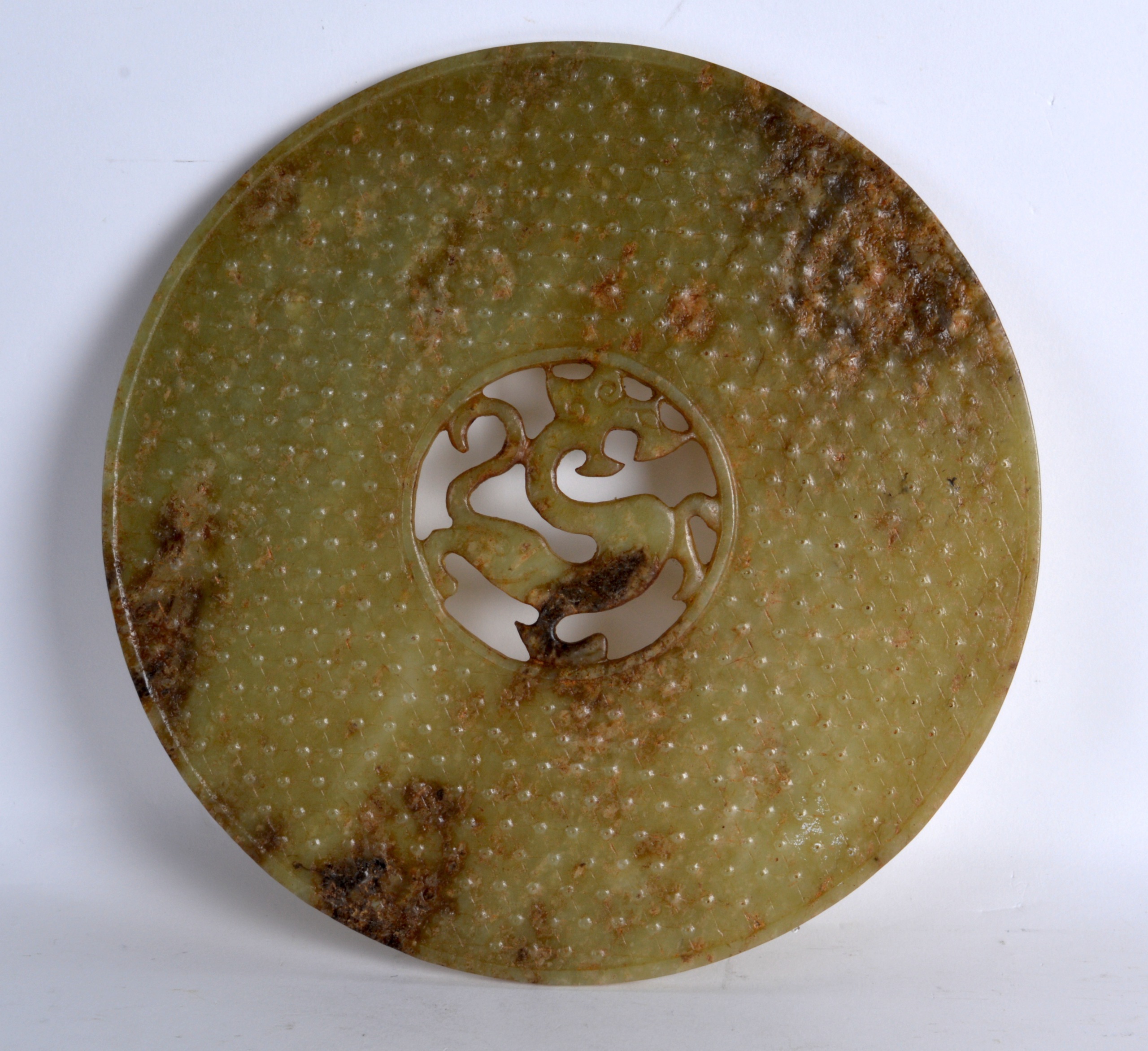 A LARGE CHINESE MUTTON JADE CIRCUALR BI DISC with centralised chilong dragon. 9.25ins diameter.