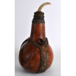 AN UNUSUAL EARLY 20TH CENTURY NORTH AFRICAN GOURD VASE & COVER with carved tooth stopper. 9.75ins