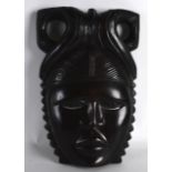 AN AFRICAN CARVED HARDWOOD MASK. 1ft 1ins high.