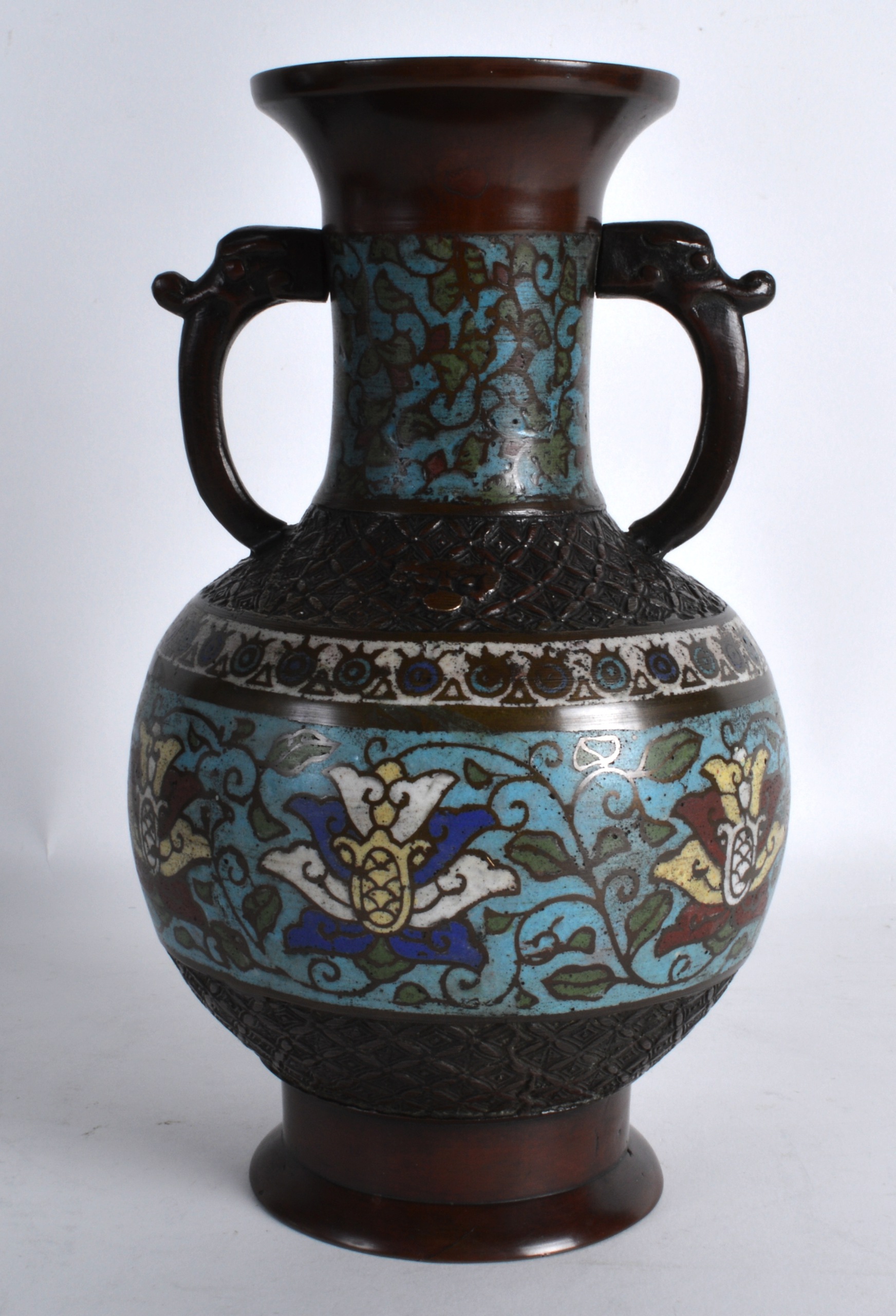 A 19TH CENTURY CHINESE TWIN HANDLED CHAMPLEVE ENAMEL VASE decorated with floral sprays. 9.5ins - Image 2 of 3