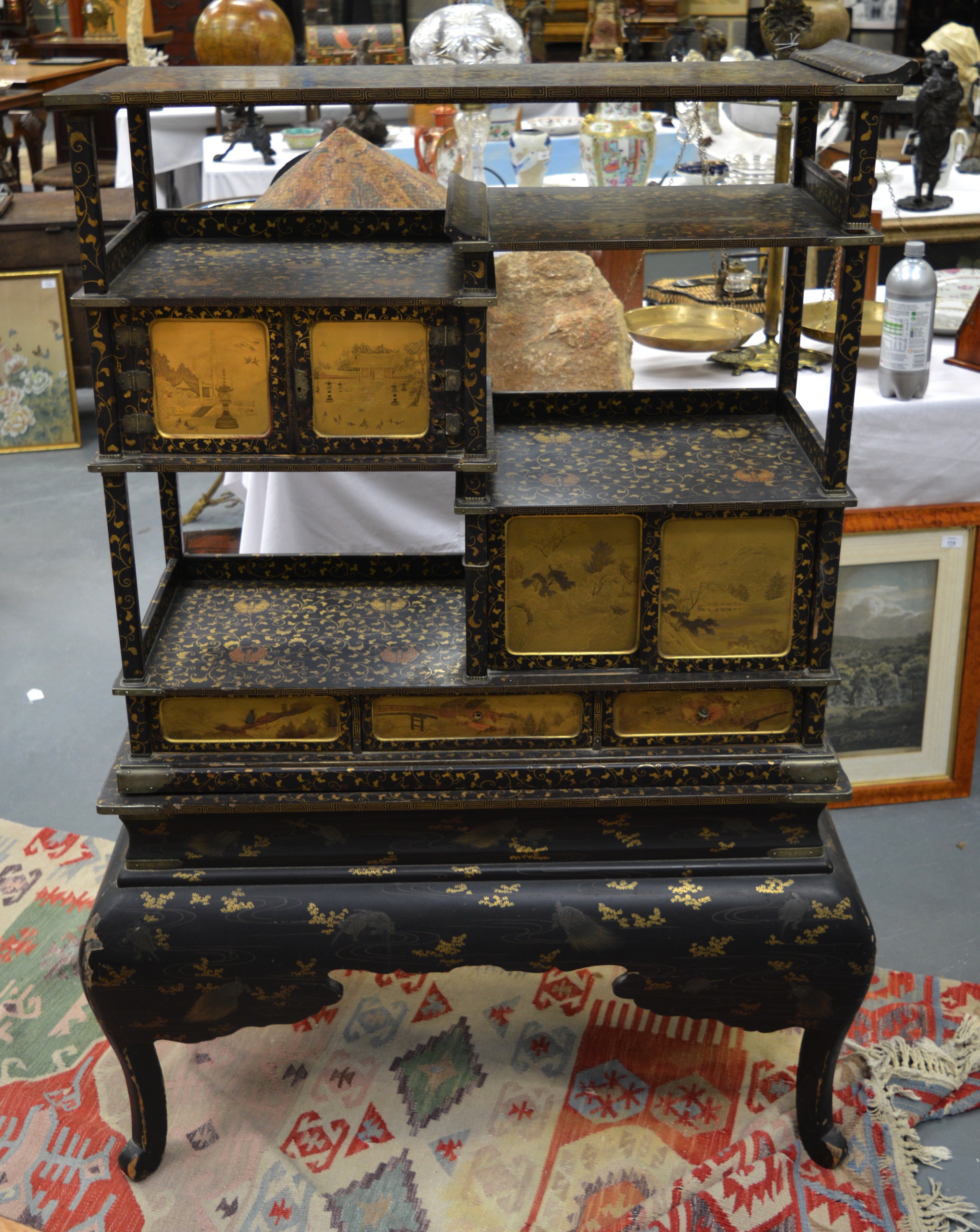 A GOOD 19TH CENTURY JAPANESE MEIJI PERIOD BLACK LACQUER CABINET ON STAND decorated with fine quality