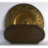 A LARGE 19TH CENTURY INDIAN EMBOSSED BRASS CHARGER together with a similar engraved lobed tray. Both