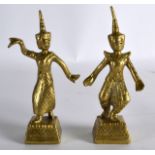 A PAIR OF EARLY 20TH CENTURY BURMESE BRASS DANCERS modelled upon square bases. 4.75ins high.