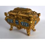 A FINE 19TH CENTURY FRENCH ORMOLU AND CHAMPLEVE ENAMEL CASKET with cherub mounts, decorated with