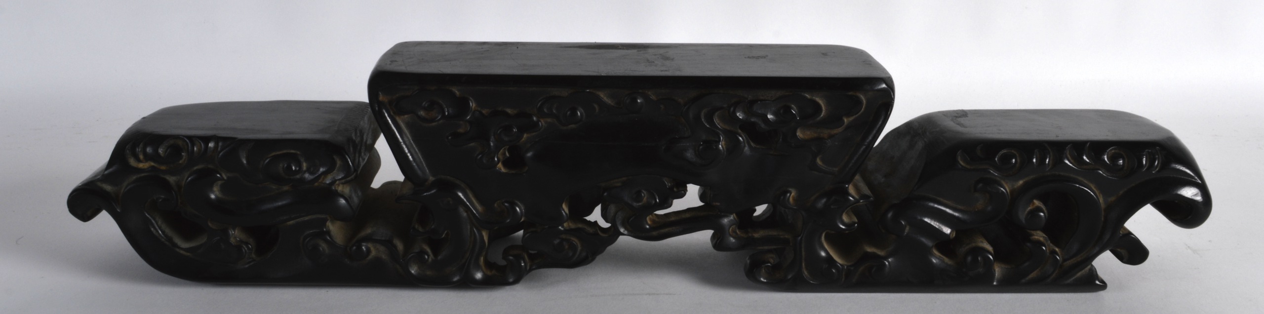 AN UNUSUAL CHINESE QING DYNASTY CARVED HARDWOOD STAND probably Zitan, with scrolling cloud shaped