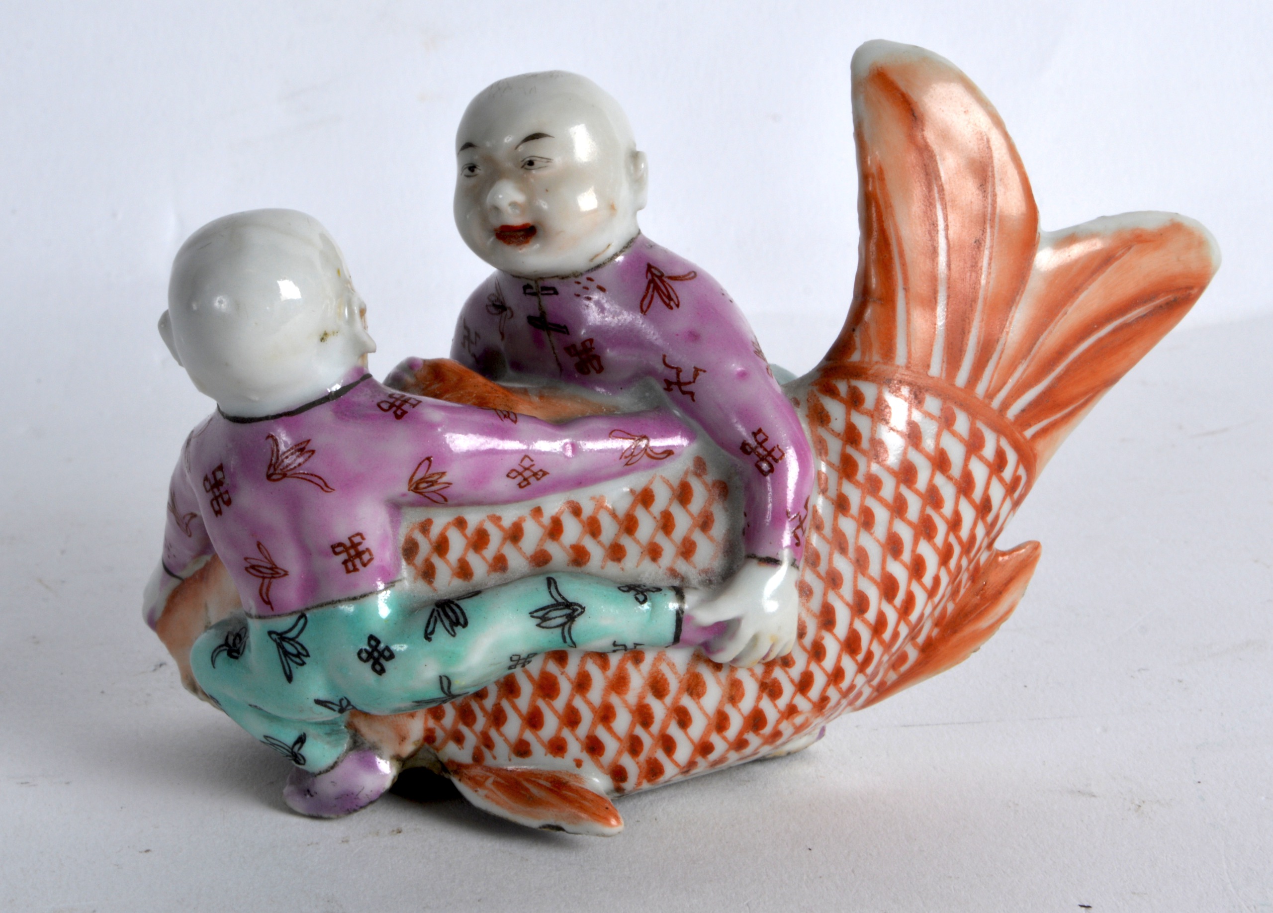 AN UNUSUAL 19TH CENTURY CHINESE FAMILLE ROSE FIGURE OF A TWO BOYS modelled holding a large carp. 4. - Image 2 of 2