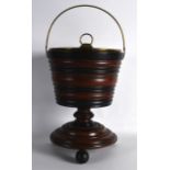 A DUTCH WOODEN BRASS LINED BUCKET with swing handle. 1ft 9ins high.