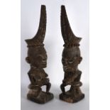 A PAIR OF EARLY 20TH CENTURY SUMATRAN FIGURES Toba Batak People. 1ft 4ins high.