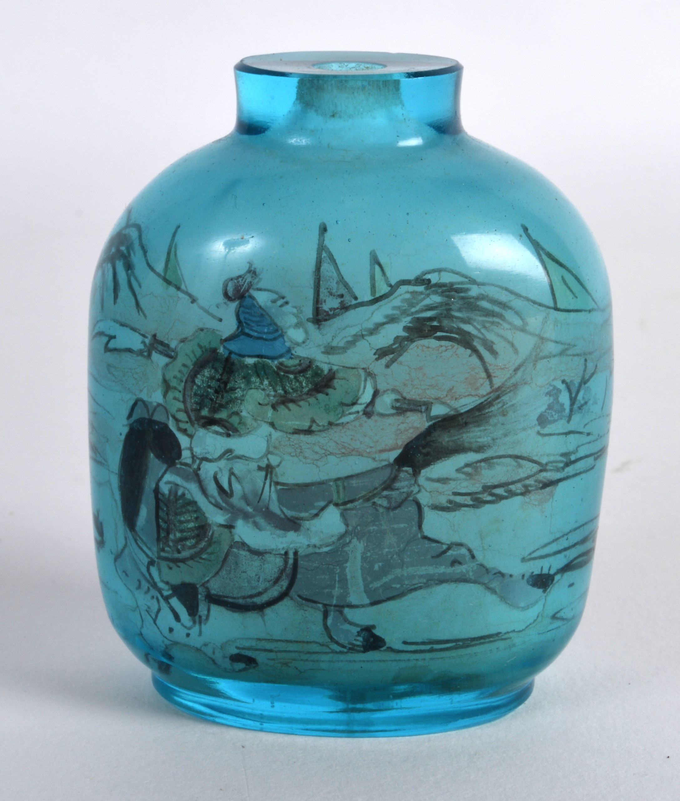 AN UNUSUAL EARLY 20TH CENTURY CHINESE REVERSE PAINTED BLUE SNUFF BOTTLE decorated with equestrian