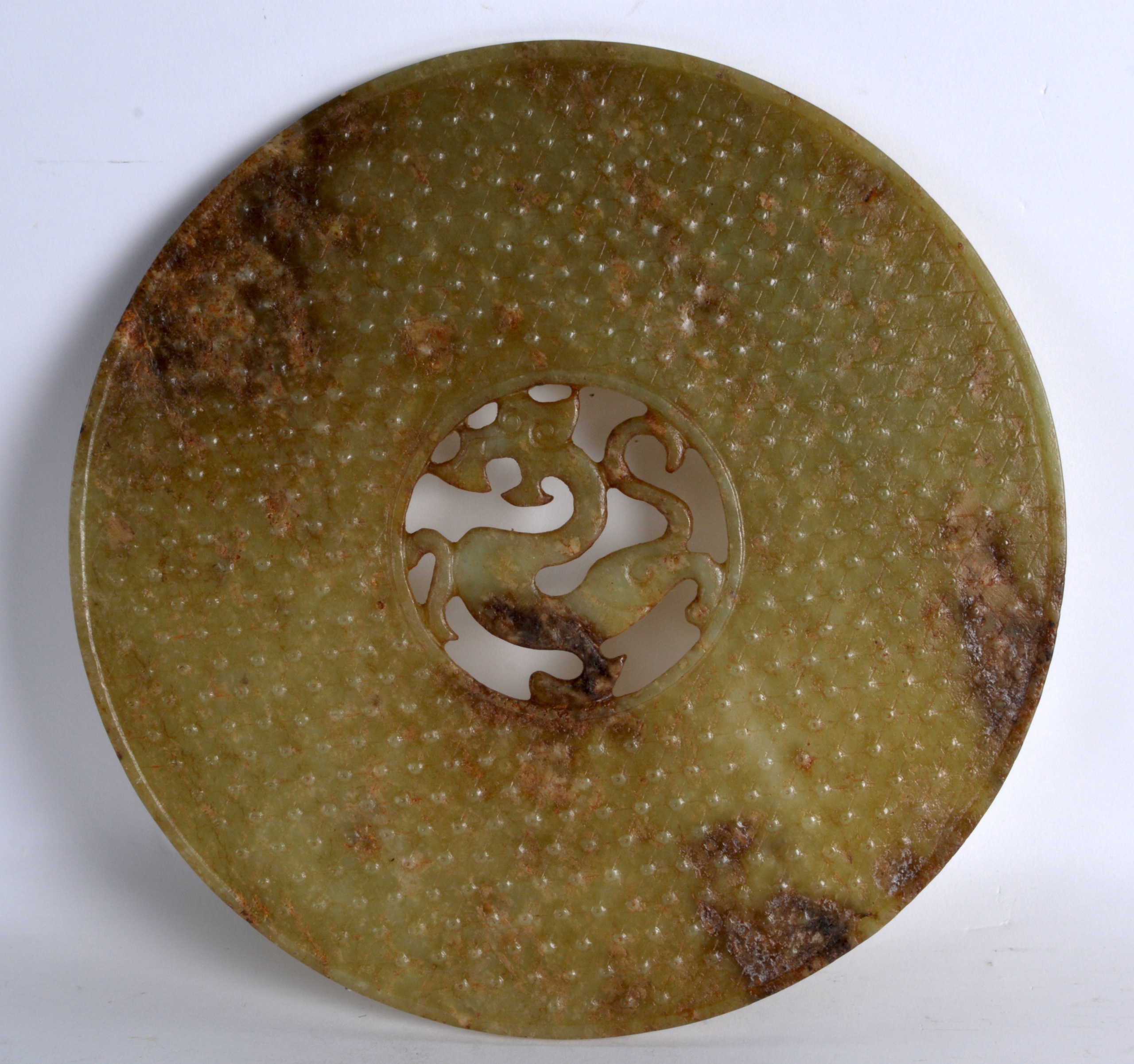 A LARGE CHINESE MUTTON JADE CIRCUALR BI DISC with centralised chilong dragon. 9.25ins diameter. - Image 2 of 2