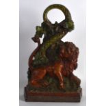 A 19TH CENTURY CAST IRON MYTHOLOGICAL LION & SERPENT DOOR STOP with loop handle. 1ft high.