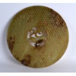 A LARGE CHINESE MUTTON JADE CIRCUALR BI DISC with centralised chilong dragon. 9.25ins diameter.