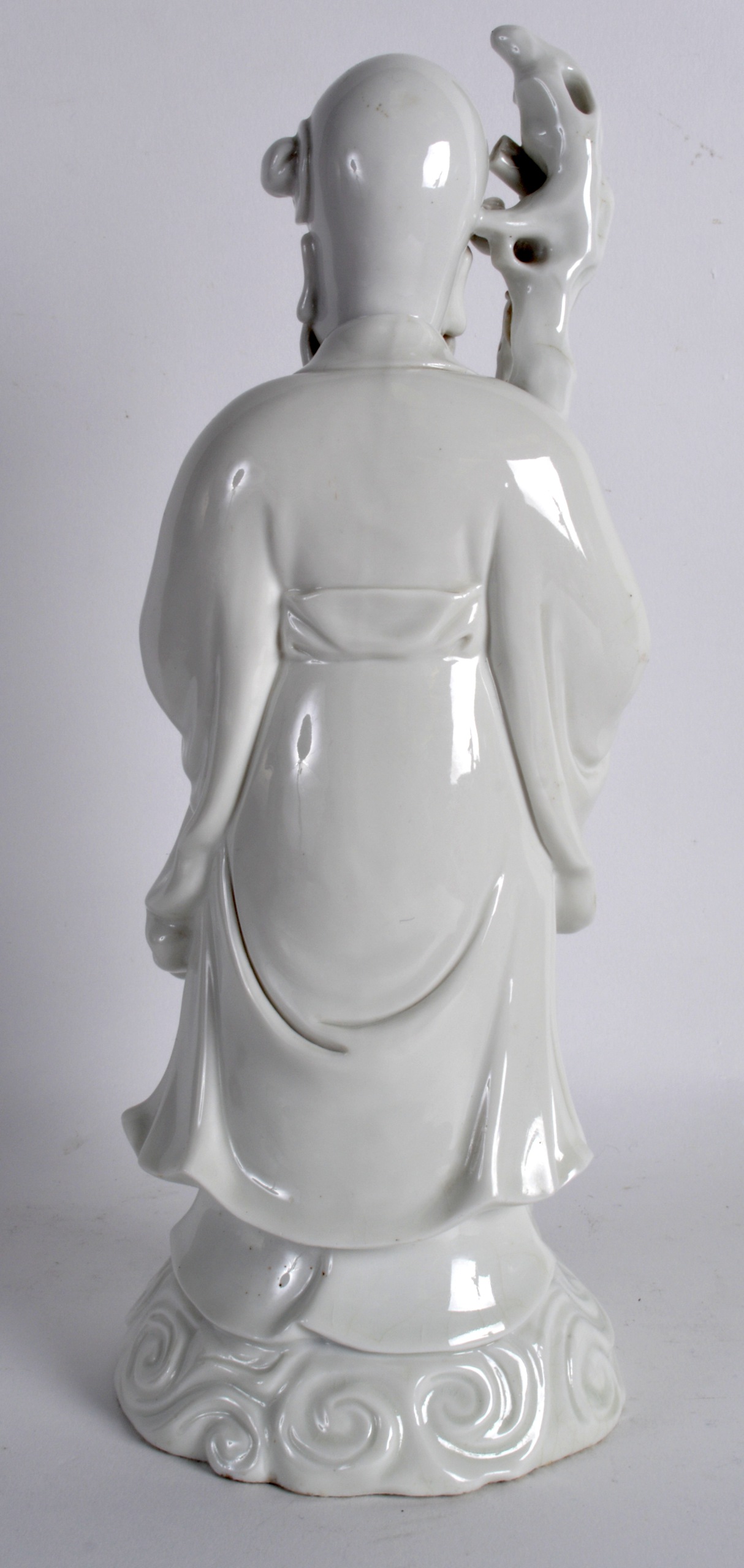 A 19TH CENTURY CHINESE BLANC DE CHINE FIGURE OF SAGE modelled holding a peach and staff. 11.5ins - Image 2 of 3