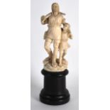 A 19TH CENTURY CARVED EUROPEAN IVORY FIGURE OF A MALE modelled standing beside a child, upon a