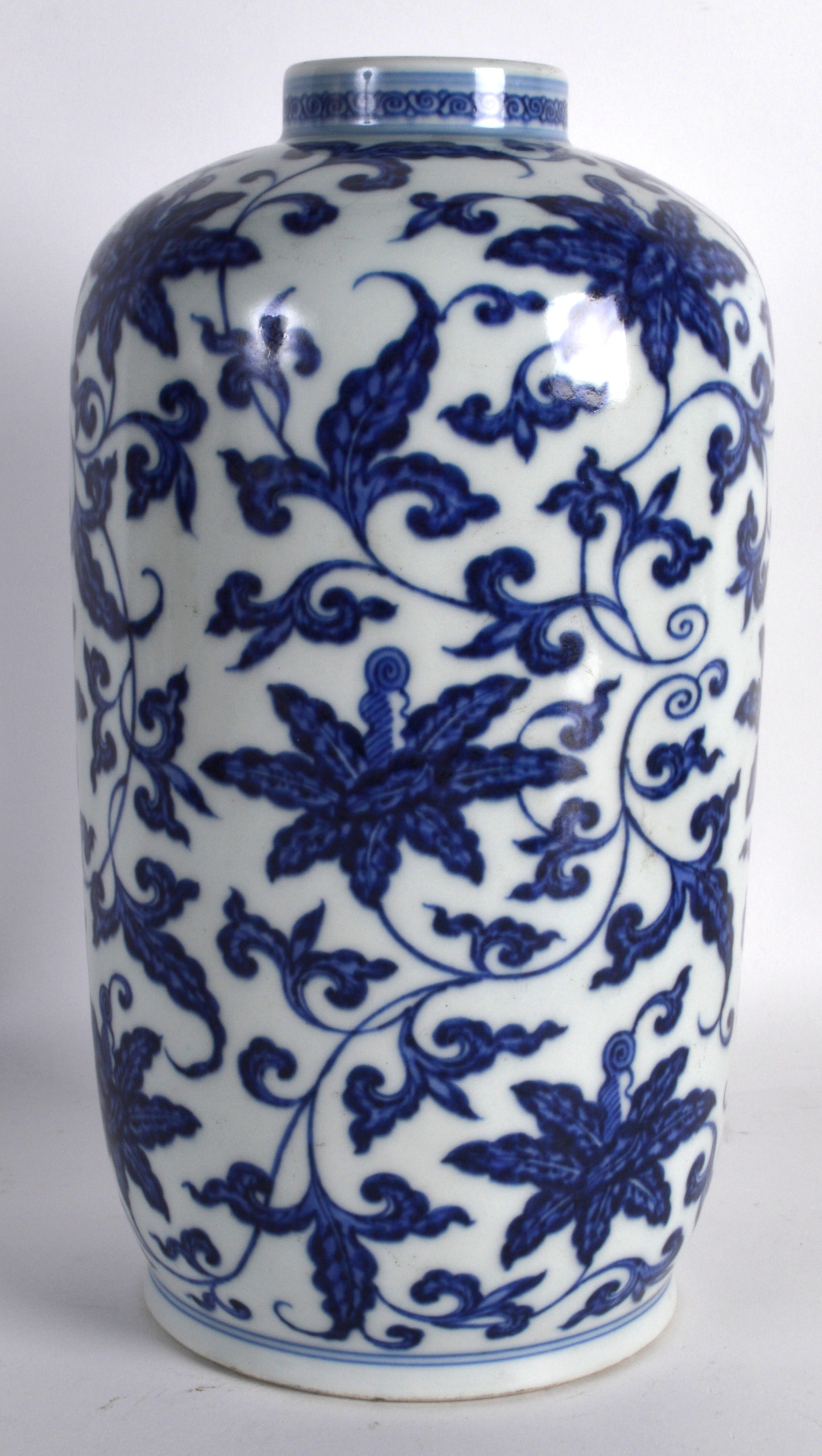 A CHINESE BLUE AND WHITE PORCELAIN VASE bearing Yongzheng marks to base, painted with stylised