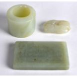 A CHINESE CARVED JADEITE TABLET together with an archers ring & a small carving of an animal. (3)