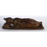 AN 18TH/19TH CENTURY SOUTH EAST ASIAN LACQUERED WOOD BUDDHA modelled reclining upon a rectangular