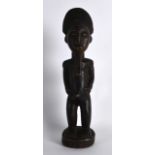 AN EARLY 20TH CENTURY AFRICAN CARVED HARWOOD FIGURE OF A BEARDED MALE. 11.75ins high.