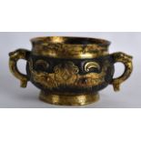 A GOOD CHINESE TWIN HANDLED BRONZE CENSER bearing Xuande marks to base, with stylised handles and