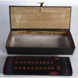 AN EARLY 20TH CENTURY CHINESE BOXED RECTANGULAR INK BLOCK decorated with calligraphy. 8.75ins long.