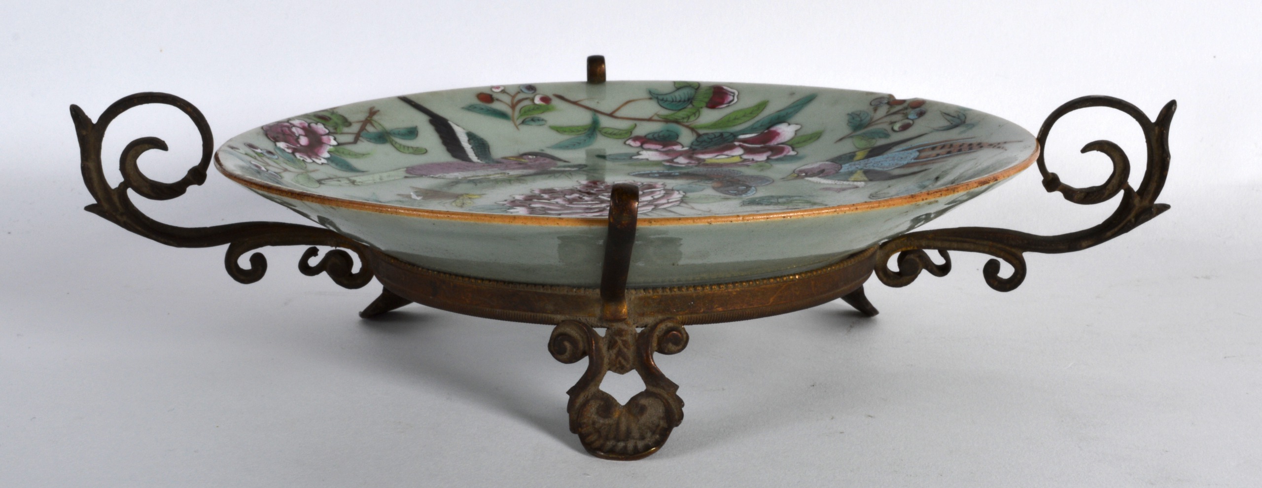 A 19TH CENTURY CHINESE CANTON CELADON FAMILLE ROSE DISH with French mounts, painted with butterflies