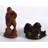 AN EARLY 20TH CENTURY CHINESE CARVED RED AMBER BUDDHIST LION together with a carved bamboo figure of