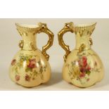 A MATCHED PAIR OF ROYAL WORCESTER CHINA JUGS, 1903/10, of lobed oval form with flared rims and coral